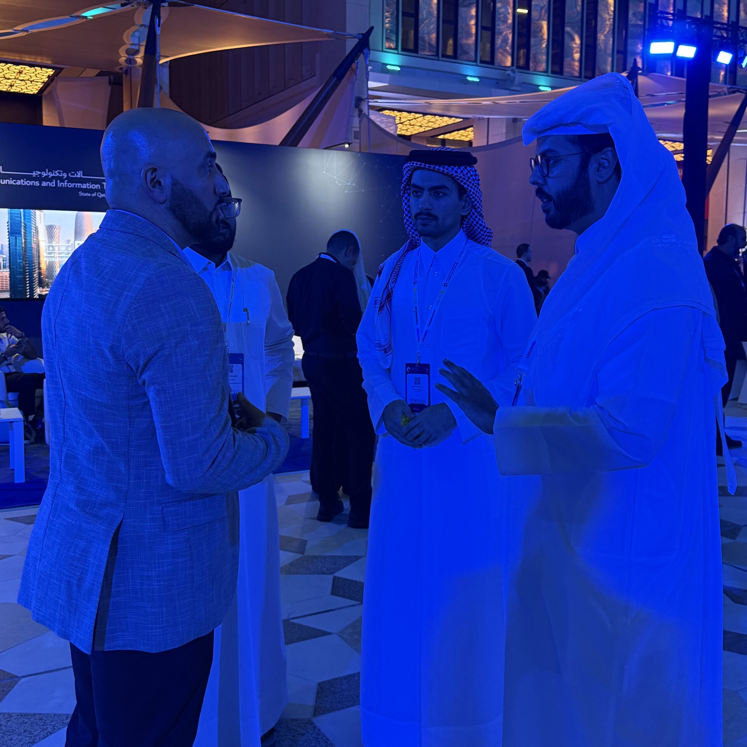 An image showing people interacting in a professional or social setting. Their body language suggests collaboration and engagement, conveying a sense of teamwork, diversity, and human connection suitable for corporate, community, or lifestyle contexts.